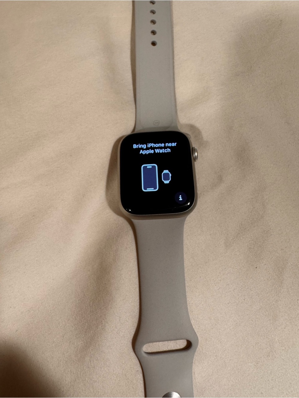 Apple Watch in light gray with silicone sport band